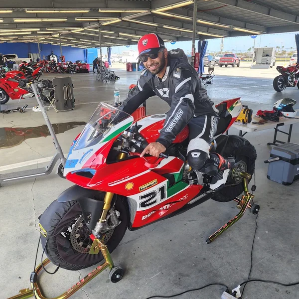 Dr. Shaikh on a motorcycle